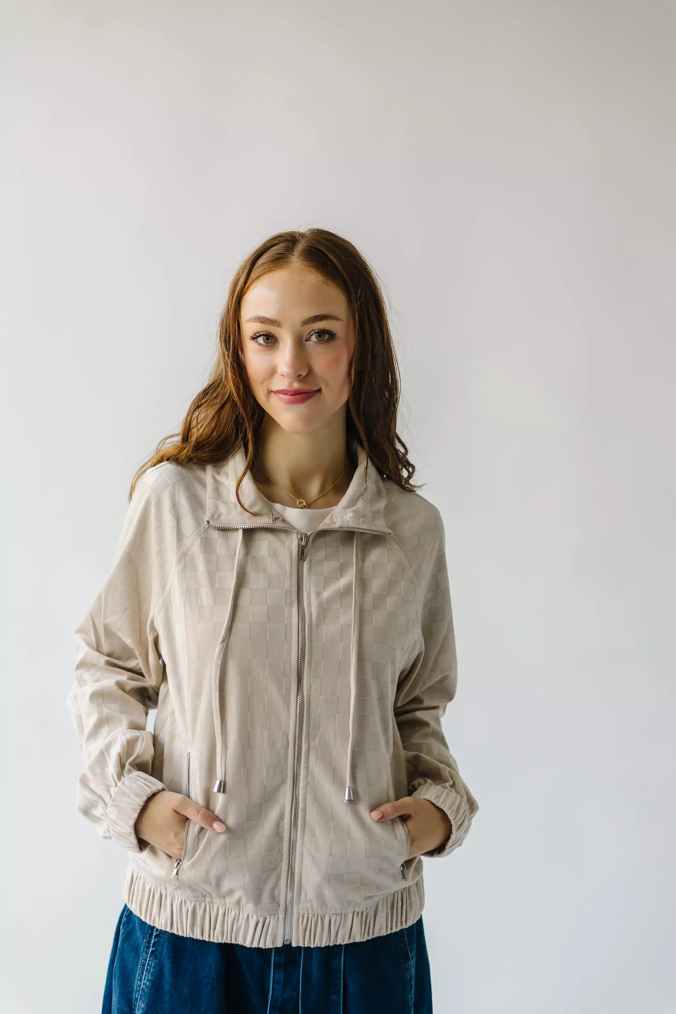 The Odon Checkered Velvet Bomber Jacket in Taupe